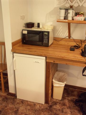 Microwave and Refrigerator at the Backwoods lodge.