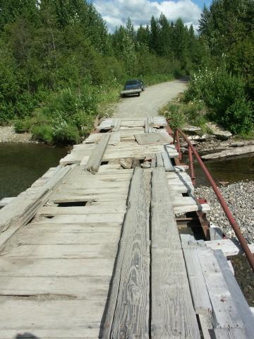 A "spiffy" little bridge we found out in the Wasilla area.  It had been closed once, but somebody moved the baricades and its being used again.....